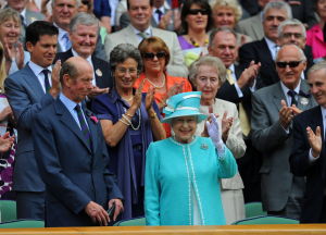 Britain's Queen Elizabeth II waves as she attends the match between Britain's Andy Murray and Finland's Jarkko Nieminen during her visit to the Wimbledon Tennis Championships, at the All England Lawn Tennis Club in southwest London, on June 24, 2010.     AFP PHOTO / ADRIAN DENNIS (Photo credit should read ADRIAN DENNIS/AFP/Getty Images)