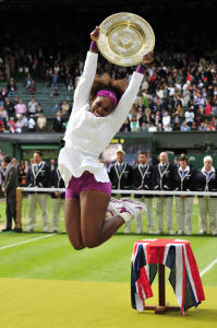 US player Serena Williams celebrates with the trophy, the Venus Rosewater Dish after her women's singles final victory over Poland's Agnieszka Radwanska on day 12 of the 2012 Wimbledon Championships tennis tournament at the All England Tennis Club in Wimbledon, southwest London, on July 7, 2012. Serena Williams won the match 6-1, 5-7, 6-2. PHOTO/ GYN KIRK RESTRICTED TO EDITORIAL USE (Photo credit should read GLYN KIRK/AFP/GettyImages)