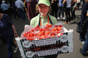 LONDON, ENGLAND - JUNE 25: Strawberries are carried around the grounds during day two of the Wimbledon Lawn Tennis Championships at the All England Lawn Tennis and Croquet Club on June 25, 2013 in London, England.  (Photo by Dan Kitwood/Getty Images)