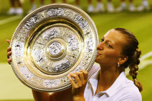LONDON, ENGLAND - JULY 05:  Petra Kvitova of Czech Republic poses with the Venus Rosewater Dish trophy after her victory in the Ladies' Singles final match against Eugenie Bouchard of Canada on day twelve of the Wimbledon Lawn Tennis Championships at the All England Lawn Tennis and Croquet Club on July 5, 2014 in London, England.  (Photo by Al Bello/Getty Images)