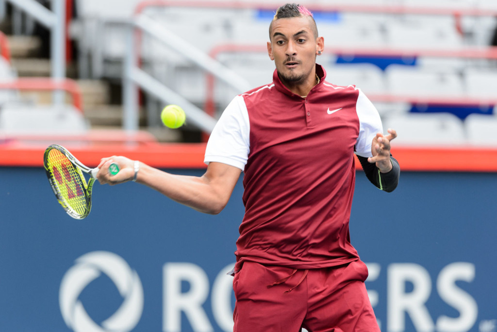 MONTREAL, ON - AUGUST 11:  Nick Kyrgios of Australia returns the ball to Fernando Verdasco of Spain during day two of the Rogers Cup at Uniprix Stadium on August 11, 2015 in Montreal, Quebec, Canada.  (Photo by Minas Panagiotakis/Getty Images)