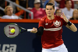MONTREAL, ON - AUGUST 11:  Milos Raonic of Canada hits the ball against Ivo Karlovic of Croatia during day two of the Rogers Cup at Uniprix Stadium on August 11, 2015 in Montreal, Quebec, Canada.  Ivo Karlovic defeated Milos Raonic 7-6, 7-6.  (Photo by Minas Panagiotakis/Getty Images)