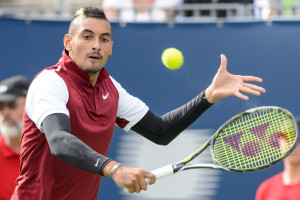 MONTREAL, ON - AUGUST 13:  Nick Kyrgios of Australia hits a return against John Isner of the USA during day four of the Rogers Cup at Uniprix Stadium on August 13, 2015 in Montreal, Quebec, Canada.  (Photo by Minas Panagiotakis/Getty Images)