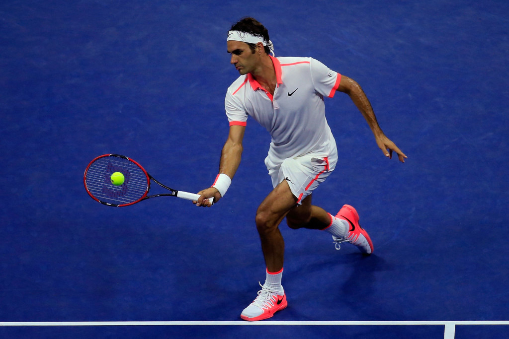 NEW YORK, NY - SEPTEMBER 07: Roger Federer of Switzerland returns a shot against John Isner of the United States during their Men's Singles Fourth Round match on Day Eight of the 2015 U.S. Open at the USTA Billie Jean King National Tennis Center on September 7, 2015 in the Flushing neighborhood of the Queens borough of New York City.  (Photo by Chris Trotman/Getty Images for the USTA)