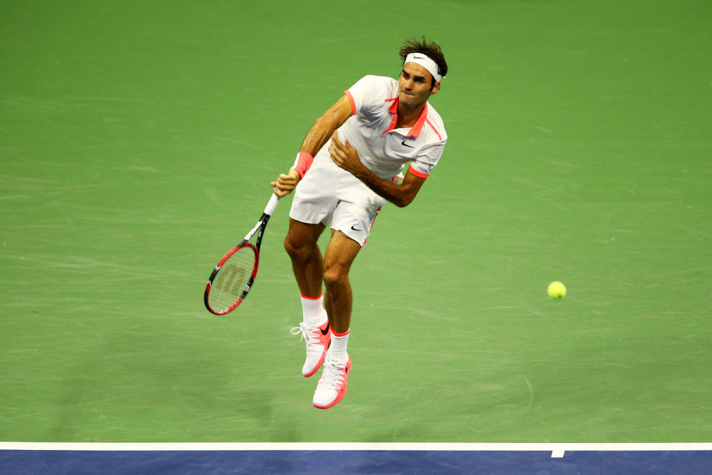 NEW YORK, NY - SEPTEMBER 11:  Roger Federer of Switzerland serves to Stan Wawrinka of Switzerland during their Men's Singles Semifinals match on Day Twelve of the 2015 US Open at the USTA Billie Jean King National Tennis Center on September 11, 2015 in the Flushing neighborhood of the Queens borough of New York City.  (Photo by Clive Brunskill/Getty Images)