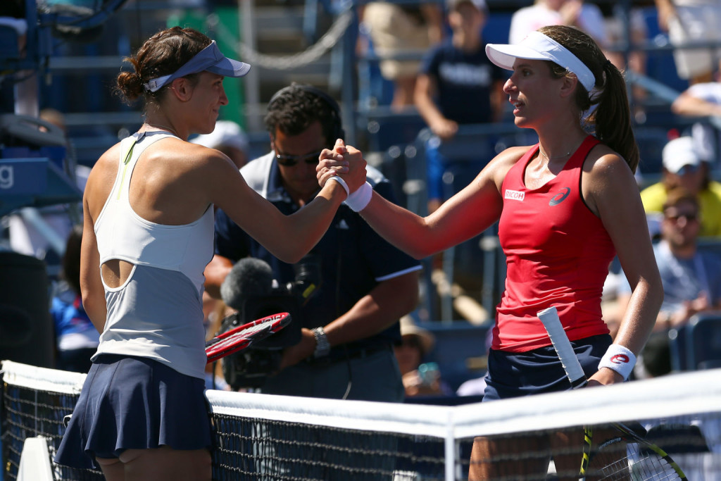 NEW YORK, NY - SEPTEMBER 05:  Johanna Konta (R) of Great Britain shakes hands with Andrea Petkovic (L) of Germany after their Women's Singles Third Round match on Day Six of the 2015 US Open at the USTA Billie Jean King National Tennis Center on September 5, 2015 in the Flushing neighborhood of the Queens borough of New York City.  (Photo by Clive Brunskill/Getty Images)