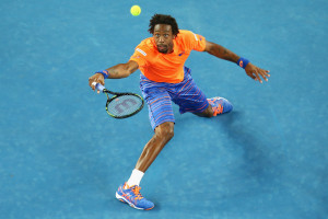 MELBOURNE, AUSTRALIA - JANUARY 20: Gael Monfils of France stretches to play a shot in his first round match against Lucas Pouille of France during day two of the 2015 Australian Open at Melbourne Park on January 20, 2015 in Melbourne, Australia. (Photo by Mark Kolbe/Getty Images)
