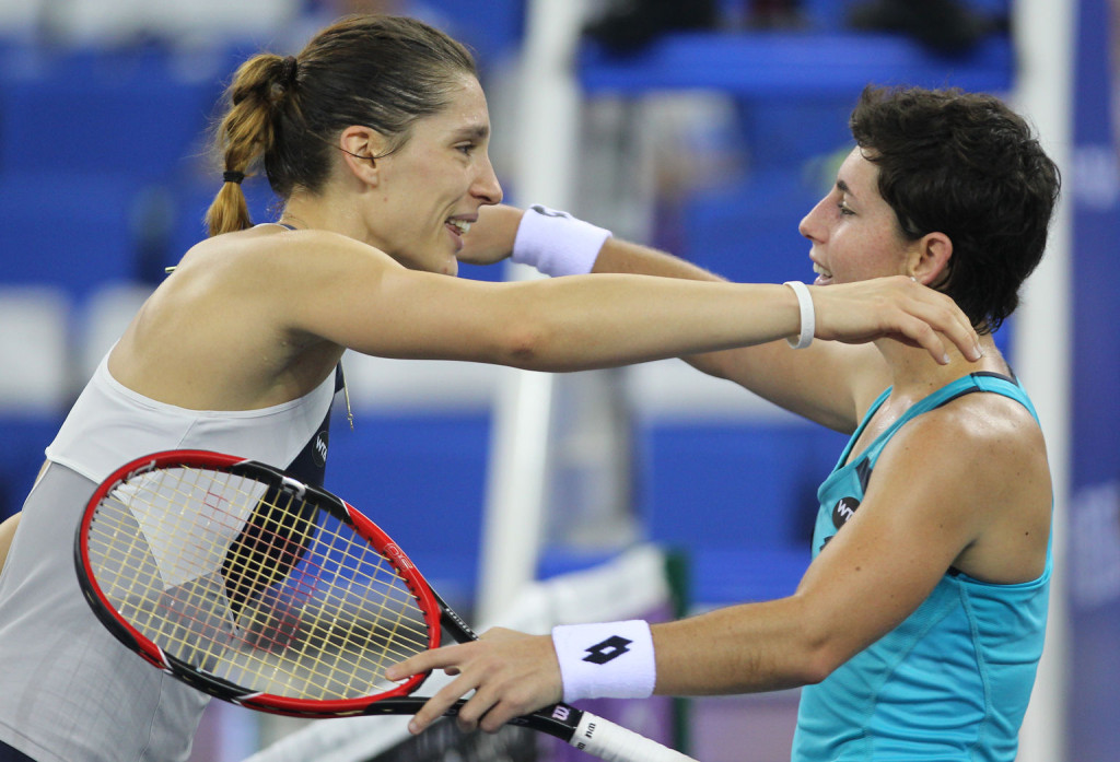 ZHUHAI, CHINA - NOVEMBER 04:  Carla Suarez Navarro (R) of Spain hugs with Andrea Petkovic of Germany after their match on day 3 of Huajin Securities WTA Elite Trophy Zhuhai at Hengqin Tennis Center on November 4, 2015 in Zhuhai, China.  (Photo by Zhong Zhi/Getty Images)