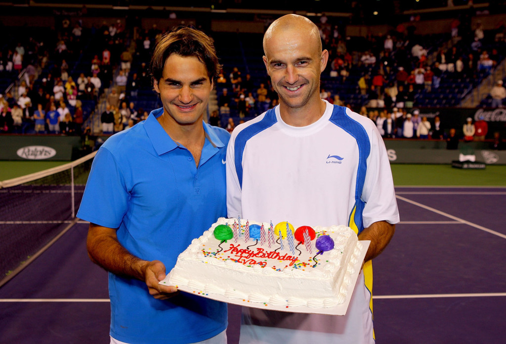 INDIAN WELLS, CA - MARCH 19: Roger Federer of Switzerland presents Ivan Ljubicic of Croatia a cake for his 29th birthday after their match during the Pacific Life Open at the Indian Wells Tennis Garden March 19, 2008 in Indian Wells, California.  (Photo by Matthew Stockman/Getty Images)