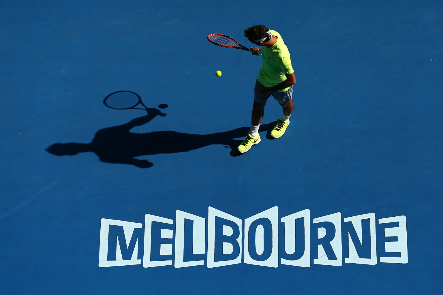 XXX of ZZZZ plays a forehand in his/her third round match against XXXX of ZZZZZ during day five of the 2015 Australian Open at Melbourne Park on January 23, 2015 in Melbourne, Australia.
