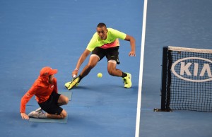 Australia's Nick Kyrgios plays a shot past a ball boy during his men's singles match against Italy's Andreas Seppi on day seven of the 2015 Australian Open tennis tournament in Melbourne on January 25, 2015. AFP PHOTO / WILLIAM WEST-- IMAGE RESTRICTED TO EDITORIAL USE - STRICTLY NO COMMERCIAL USE        (Photo credit should read WILLIAM WEST/AFP/Getty Images)