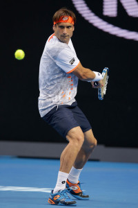 MELBOURNE, AUSTRALIA - JANUARY 25:  David Ferrer of Spain plays a backhand during his fourth round match against John Isner of the United States during day eight of the 2016 Australian Open at Melbourne Park on January 25, 2016 in Melbourne, Australia.  (Photo by Darrian Traynor/Getty Images)