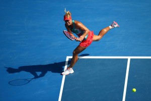 XXX of ZZZ plays a forehand in his/her semi final match against XXXX of ZZZZ during day 11 of the 2016 Australian Open at Melbourne Park on January 28, 2016 in Melbourne, Australia.