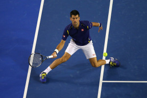 MELBOURNE, AUSTRALIA - JANUARY 28:  Novak Djokovic of Serbia plays a forehand in his semi final match against Roger Federer of Switzerland during day 11 of the 2016 Australian Open at Melbourne Park on January 28, 2016 in Melbourne, Australia.  (Photo by Cameron Spencer/Getty Images)