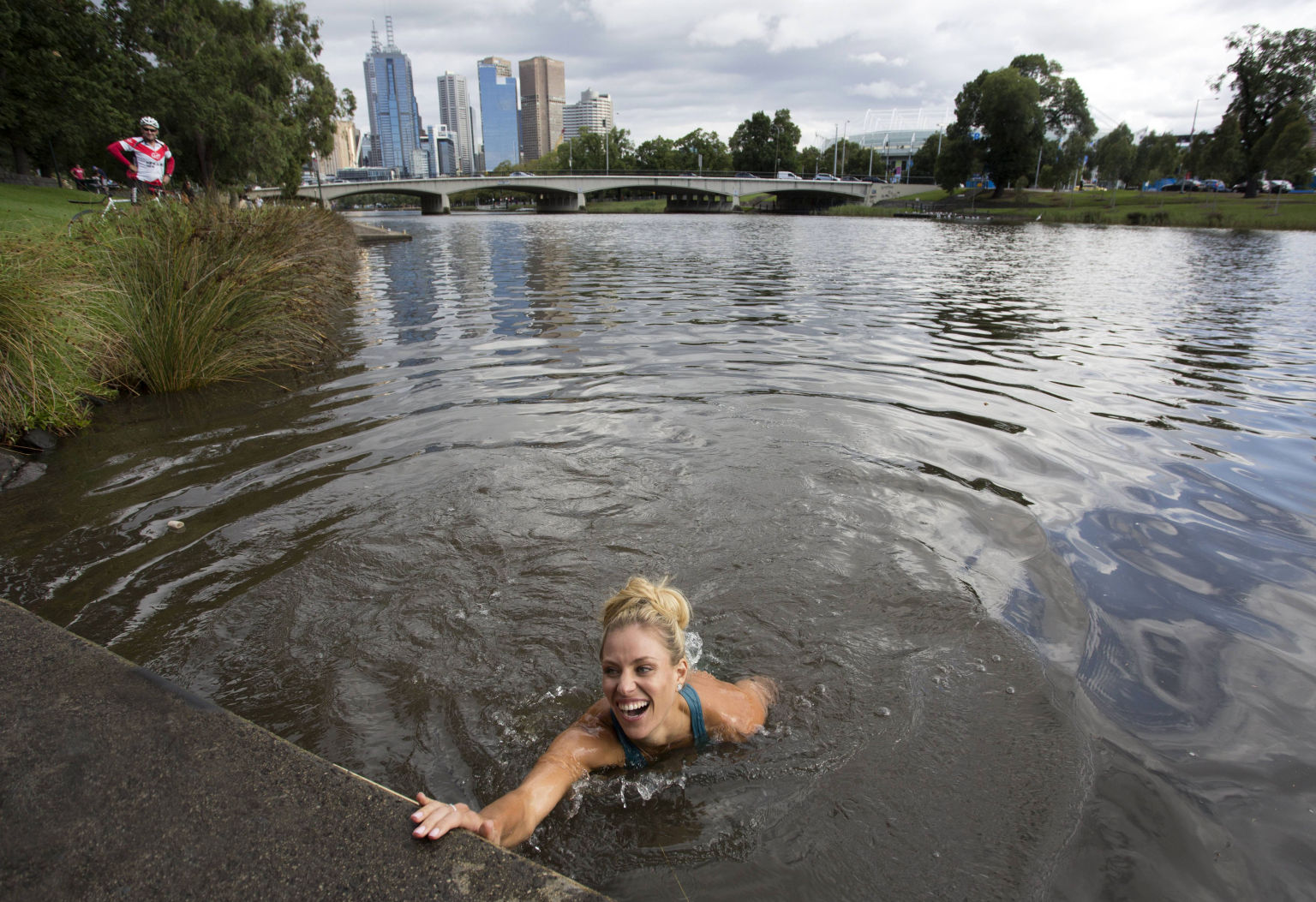 MELBOURNE, VICTORIA - JANUARY 31:  In this handout photo provided by Tennis Australia, Angelique Kerber of Germany jumps into the Yarra River on day 14 of the 2016 Australian Open at Melbourne Park on January 31, 2016 in Melbourne, Australia. Kerber defeated Serena Williams of the United States to win the Australian Women's Singles Final. (Photo by Fiona Hamilton/Tennis Australia via Getty Images)