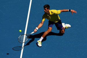 MELBOURNE, AUSTRALIA - JANUARY 18:  Novak Djokovic of Serbia plays a forehand in his first round match against Hyeon Chung of Korea during day one of the 2016 Australian Open at Melbourne Park on January 18, 2016 in Melbourne, Australia.  (Photo by Cameron Spencer/Getty Images)