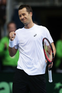 HANOVER, GERMANY - MARCH 06:  Philipp Kohlschreiber of Germany celebrate his match point in his match against Tomas Berdych of Czech Republic during Day 3 of the Davis Cup World Group first round between Germany and Czech Republic on March 6, 2016 in Hanover, Germany.  (Photo by Oliver Hardt/Bongarts/Getty Images)