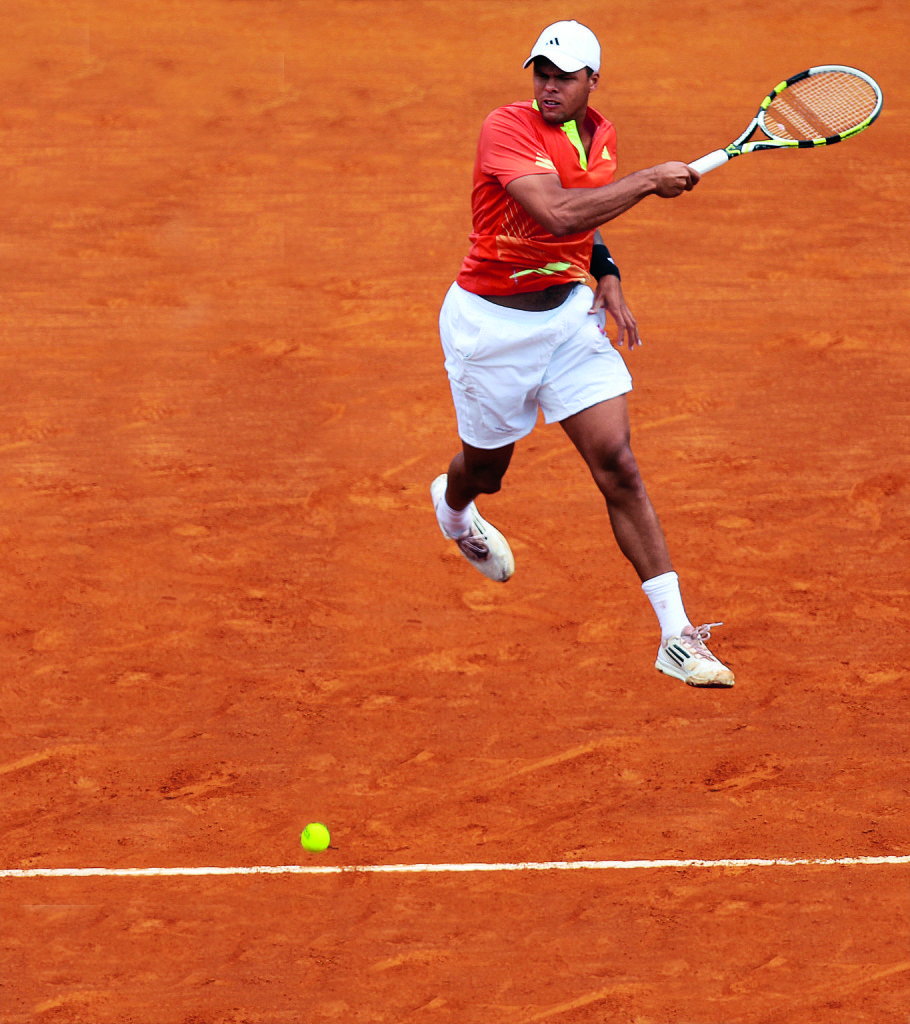 France's Jo Wilfried Tsonga hits a return to Spain's Fernando Verdasco during the Monte-Carlo ATP Masters Series Tournament tennis match on April 19, 2012 in Monaco. AFP PHOTO/ VALERY HACHE (Photo credit should read VALERY HACHE/AFP/Getty Images)