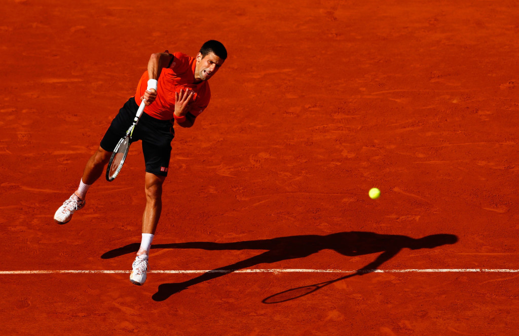 PARIS, FRANCE - JUNE 07:  Novak Djokovic of Serbia serves in the Men's Singles Final against Stanislas Wawrinka of Switzerland on day fifteen of the 2015 French Open at Roland Garros on June 7, 2015 in Paris, France.  (Photo by Julian Finney/Getty Images)