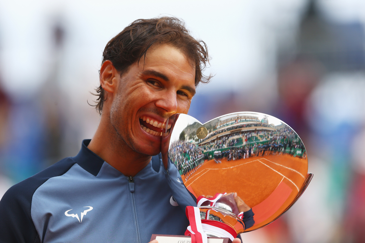 MONTE-CARLO, MONACO - APRIL 17:  Rafael Nadal of Spain celebrates with the trophy after victory in the singles final match against Gael Monfils of France during day eight of the  Monte Carlo Rolex Masters at Monte-Carlo Sporting Club on April 17, 2016 in Monte-Carlo, Monaco.  (Photo by Michael Steele/Getty Images)