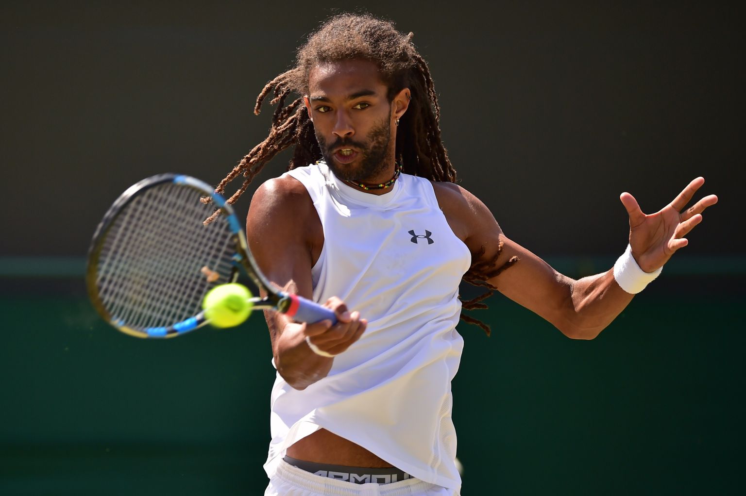 Germany's Dustin Brown returns to Serbia's Viktor Troicki during their men's singles third round match on day six of the 2015 Wimbledon Championships at The All England Tennis Club in Wimbledon, southwest London, on July 4, 2015.   RESTRICTED TO EDITORIAL USE  -- AFP PHOTO / LEON NEAL        (Photo credit should read LEON NEAL/AFP/Getty Images)