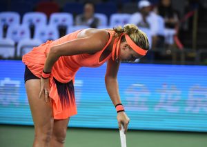 Petra Kvitova of the Czech Republic reacts in the final set before going on to win her third round match against Angelique Kerber of Germany at the WTA Wuhan Open tennis tournament in Wuhan, in China's central Hubei province on September 28, 2016. / AFP / GREG BAKER (Photo credit should read GREG BAKER/AFP/Getty Images)