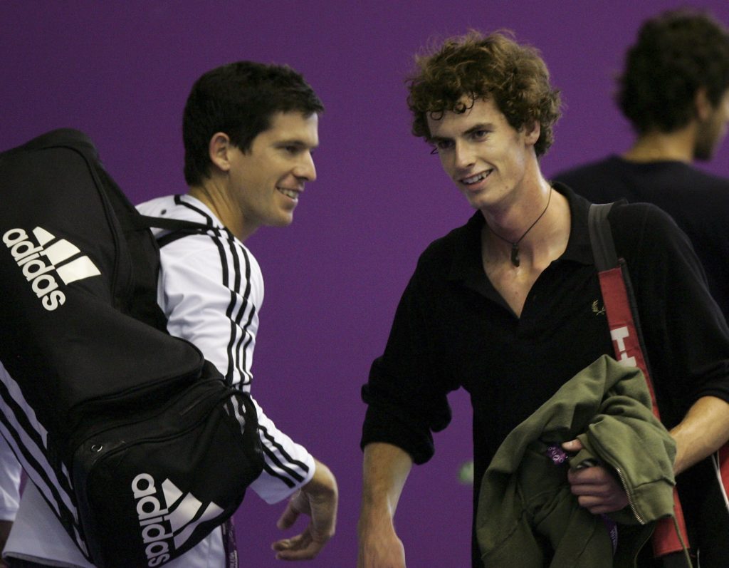 MADRID, SPAIN - OCTOBER 15: Tim Henman (L) and Andy Murray (R) pass each other on the practice courts before their first round matches in the next two days at the ATP Madrid Masters at the Nuevo Rockodromo October 15, 2006 in Madrid, Spain. (Photo by Julian Finney/Getty Images)