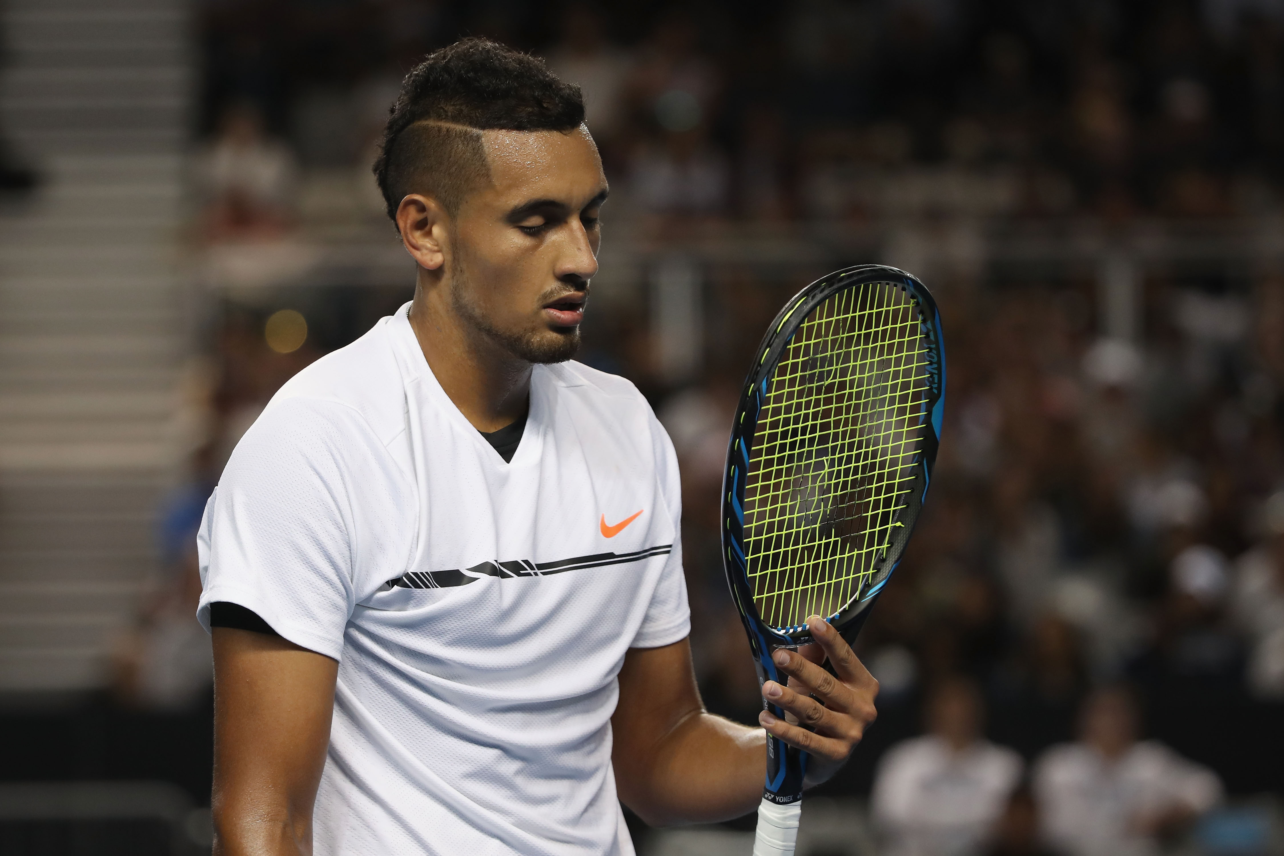 MELBOURNE, AUSTRALIA - JANUARY 17: Nick Kyrgios of Australia looks at his racquet after breaking a string during his second round match against Andreas Seppi of Italy on day three of the 2017 Australian Open at Melbourne Park on January 18, 2017 in Melbourne, Australia. (Photo by Mark Kolbe/Getty Images)