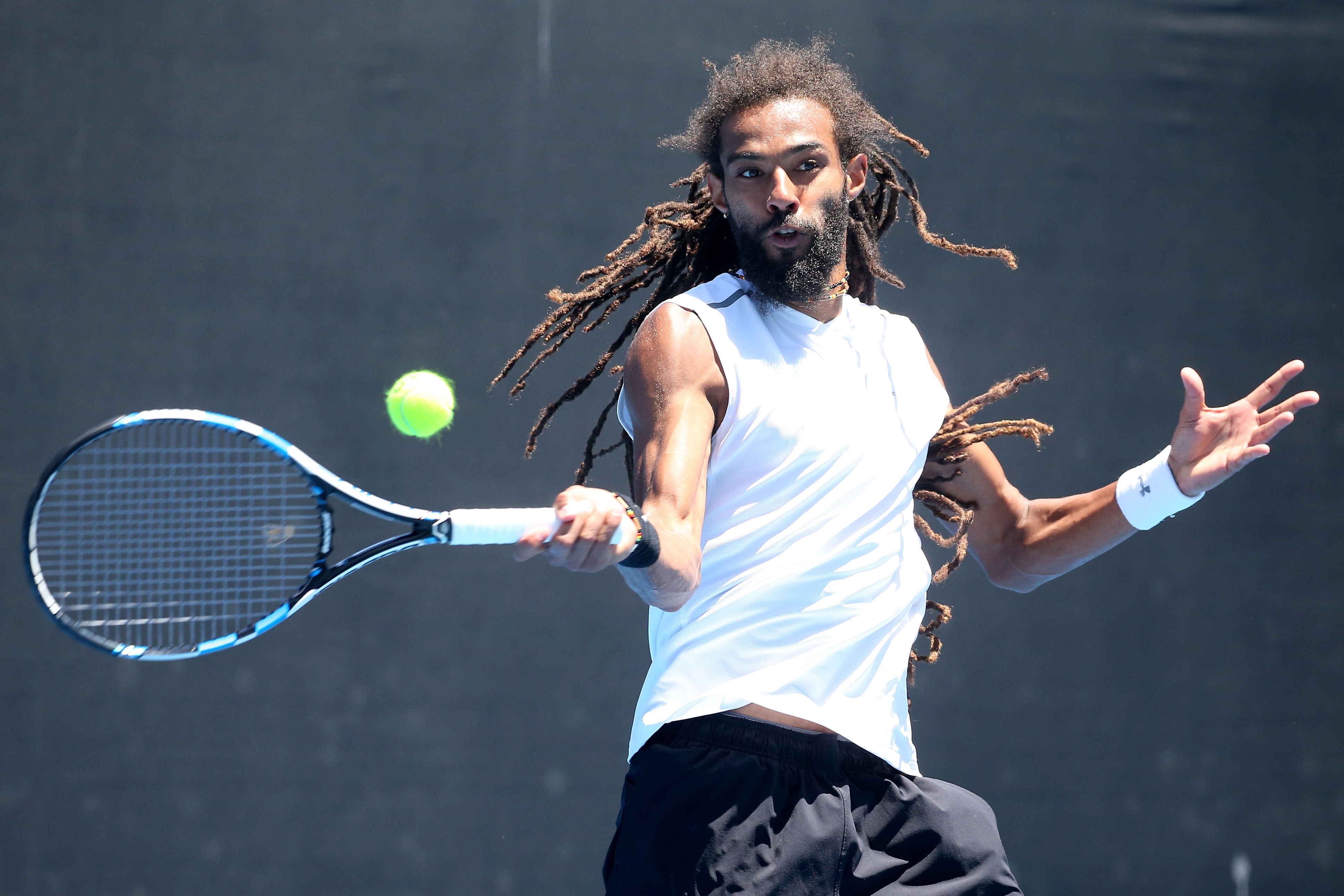 MELBOURNE, AUSTRALIA - JANUARY 19:  Dustin Brown of Germany plays a forehand in his first round doubles match with Albert Ramos-Vinolas of Spain against Nenad Zimonjic and Mischa Zverev on day four of the 2017 Australian Open at Melbourne Park on January 19, 2017 in Melbourne, Australia.  (Photo by Pat Scala/Getty Images)