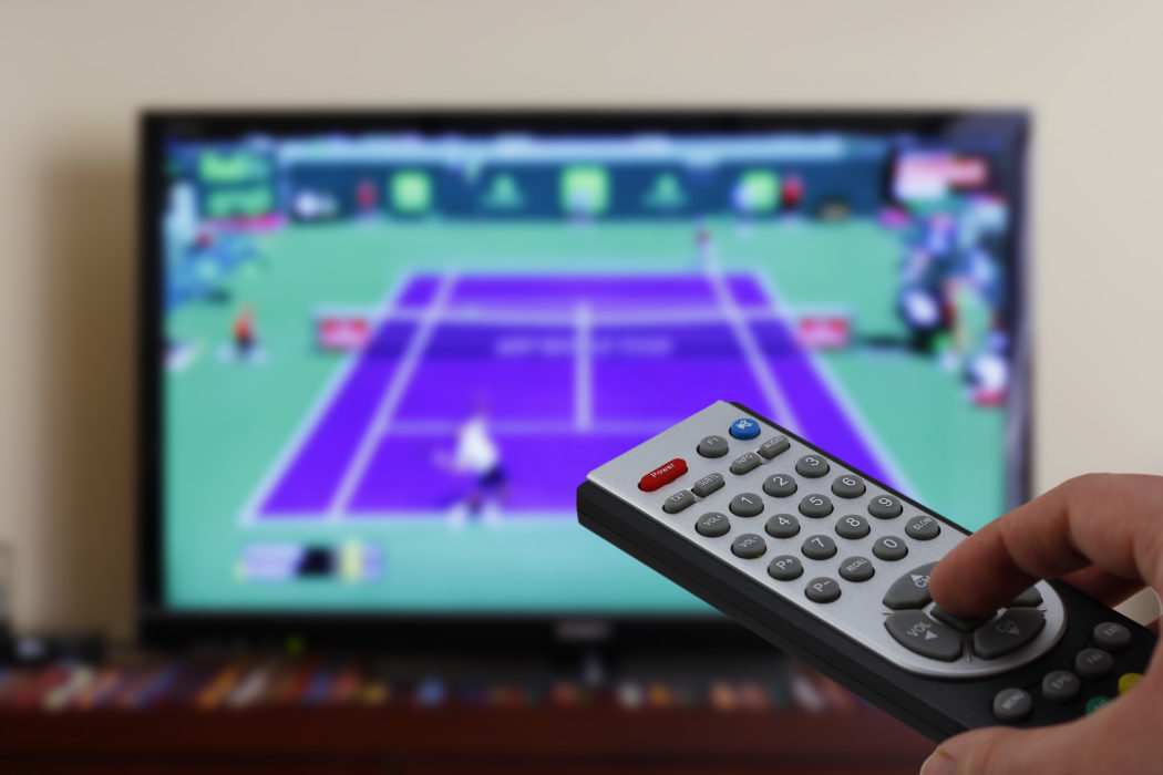 Televesion remote control in the hand, zapping