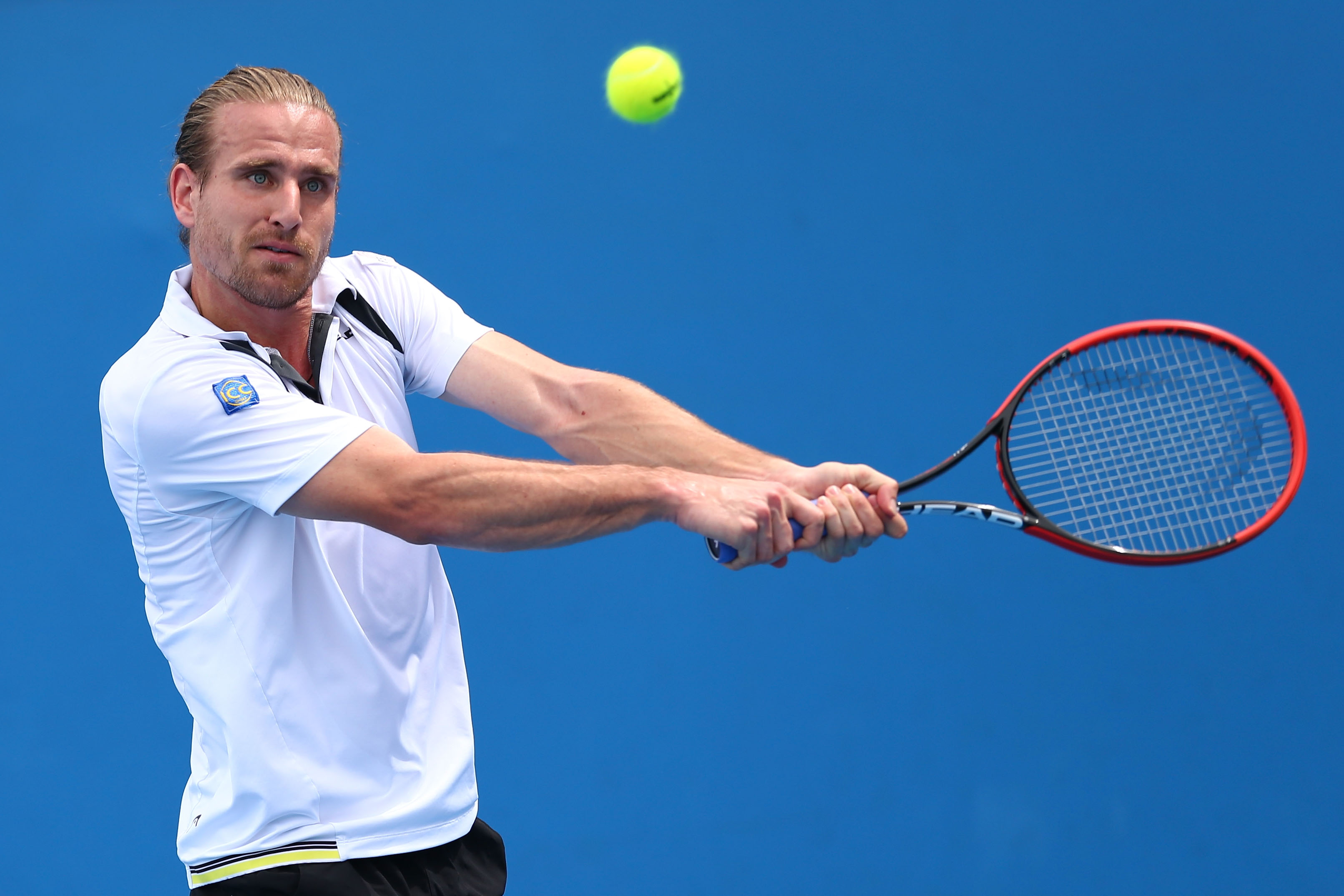 MELBOURNE, AUSTRALIA - JANUARY 20: Peter Gojowczyk of Germany plays a backhand in his first round match against Guillermo Garcia-Lopez of Spain during day two of the 2015 Australian Open at Melbourne Park on January 20, 2015 in Melbourne, Australia. (Photo by Ryan Pierse/Getty Images)