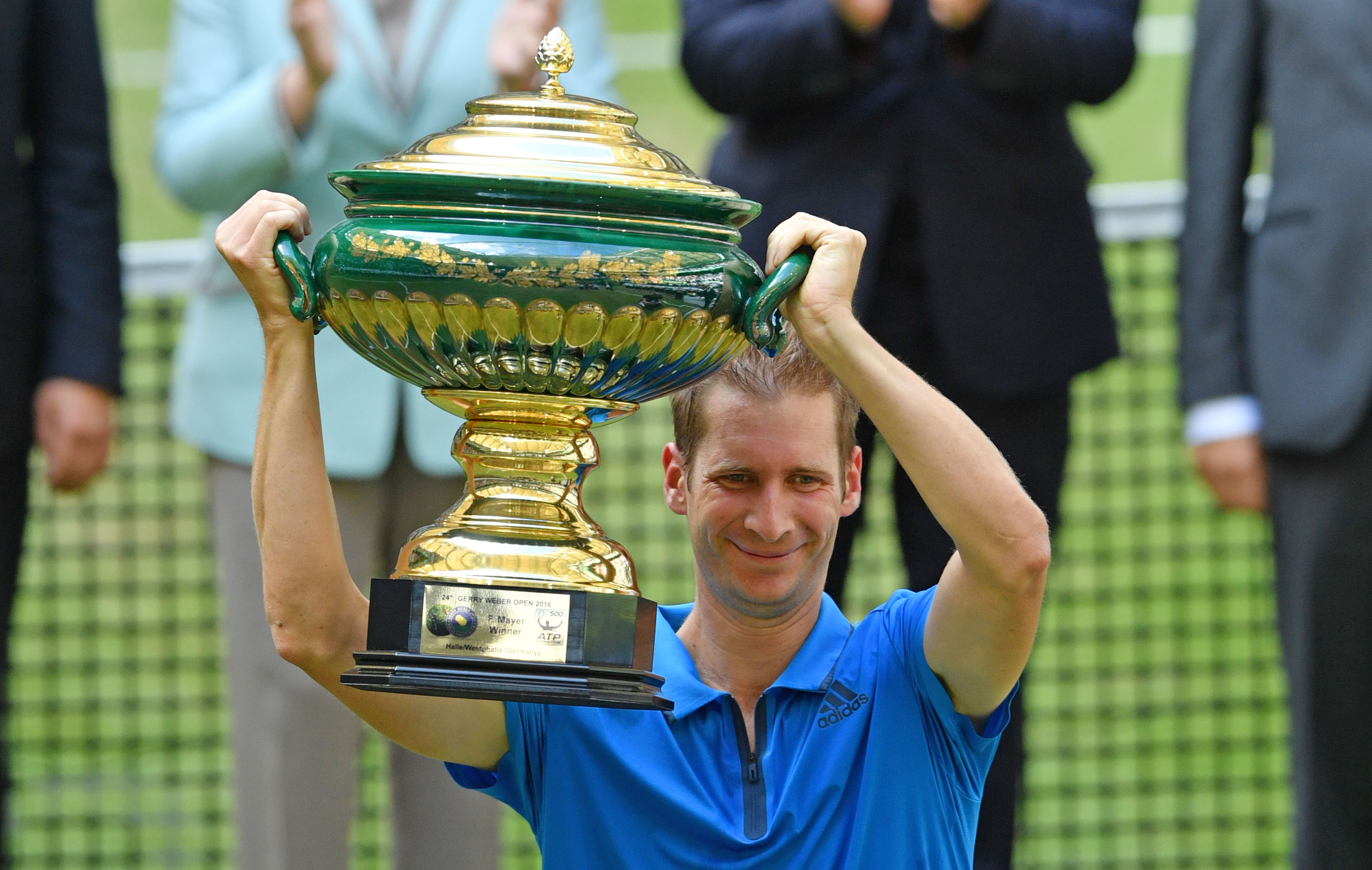 HALLE, GERMANY - JUNE 19:  Florian Mayer of Germany lifts the winners cup  after winning the final match of the Gerry Weber Open against Alexander Zverev of Germany at Gerry Weber Stadium on June 19, 2016 in Halle, Germany.  (Photo by Thomas Starke/Bongarts/Getty Images)