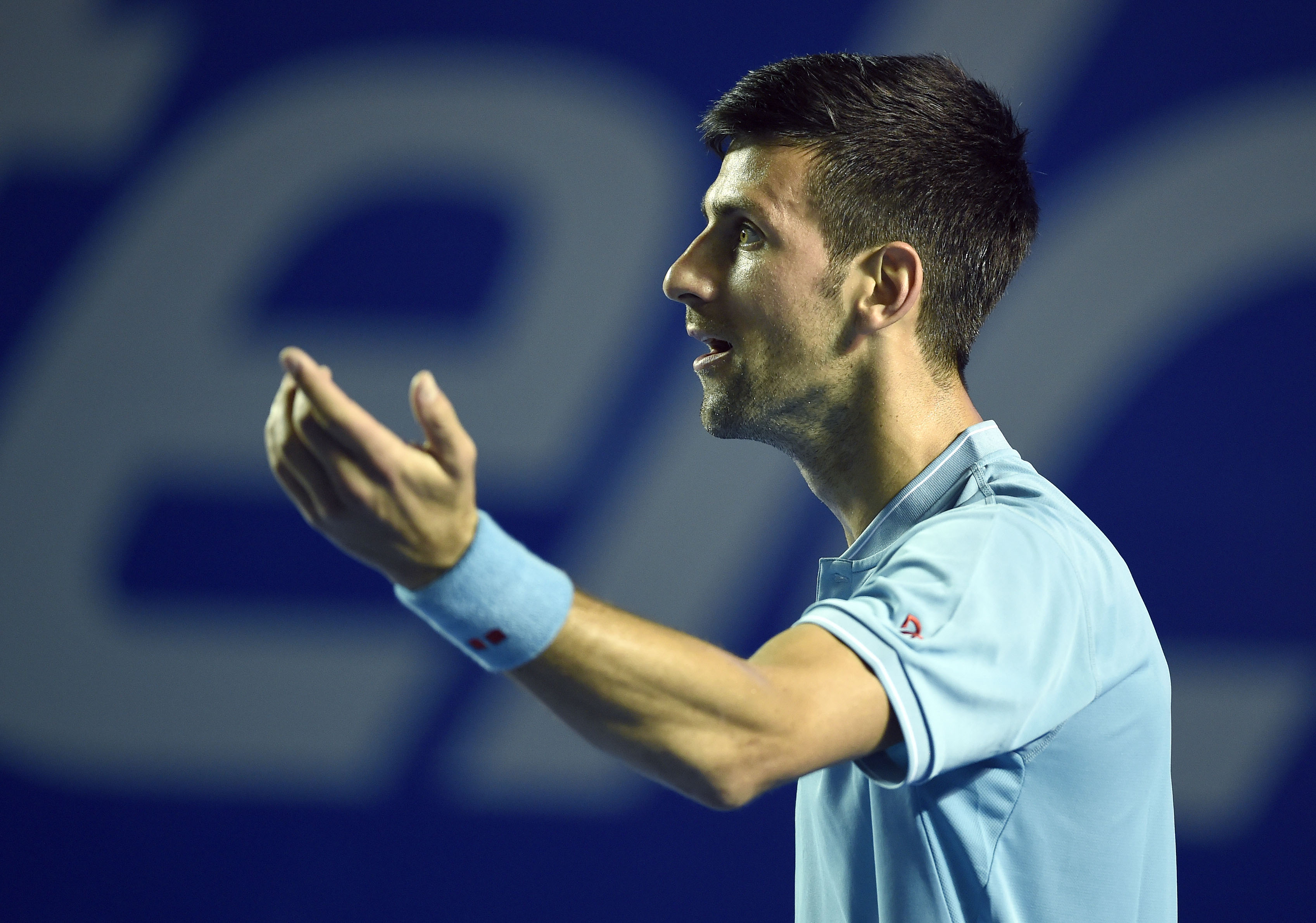 Serbian tennis player Novak Djokovic talks with referee during the fourth day of the Mexican Tennis Open, in Acapulco, Guerrero State, Mexico, on March 2, 2017. / AFP PHOTO / ALFREDO ESTRELLA (Photo credit should read ALFREDO ESTRELLA/AFP/Getty Images)