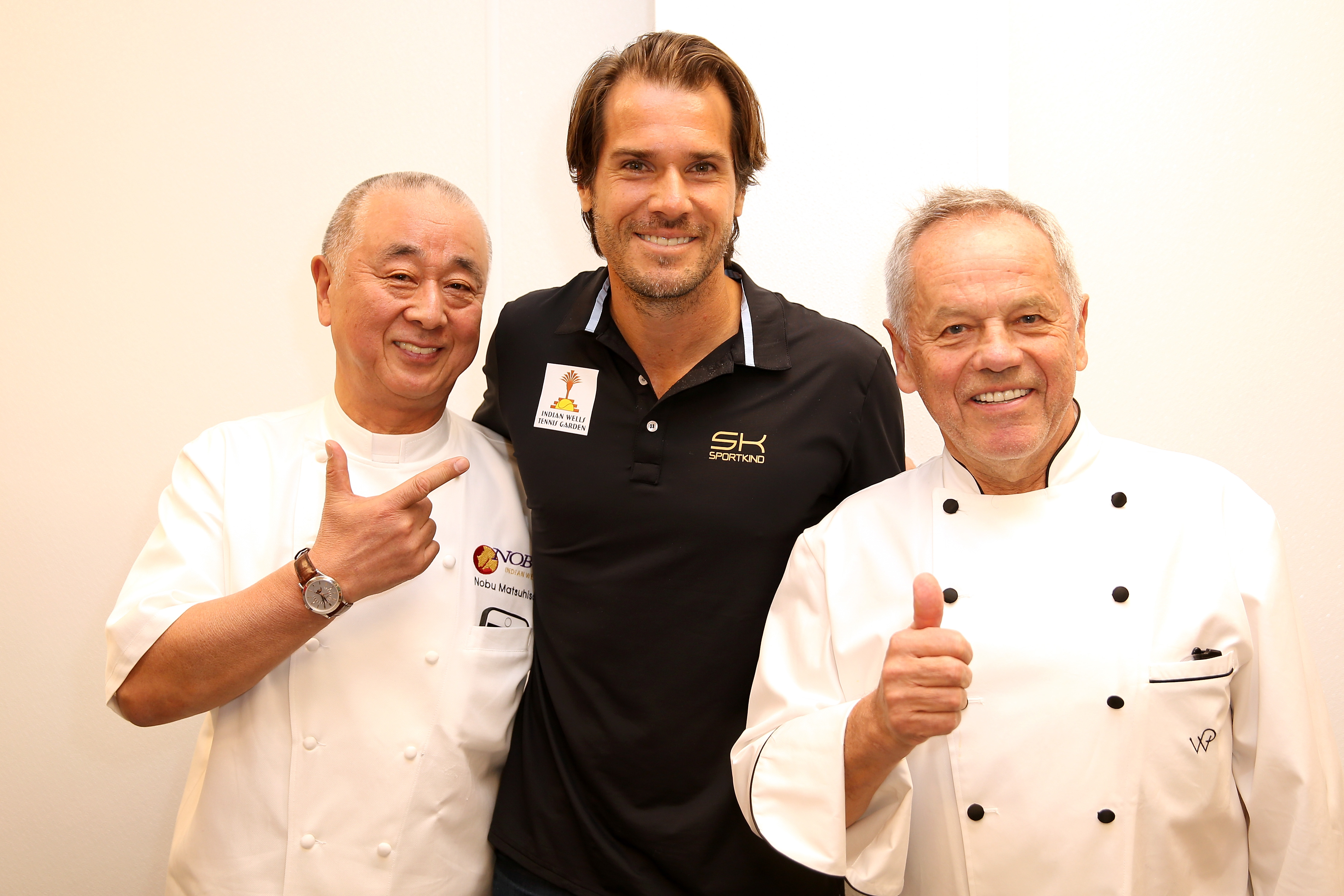 INDIAN WELLS, CA - MARCH 07:  Tournament director Tommy Haas poses with celebrity chefs Nobu Matsuhisa and Wolfgang  Puck during the BNP Paribas Open at the Indian Wells Tennis Garden on March 7, 2017 in Indian Wells, California.  (Photo by Matthew Stockman/Getty Images)