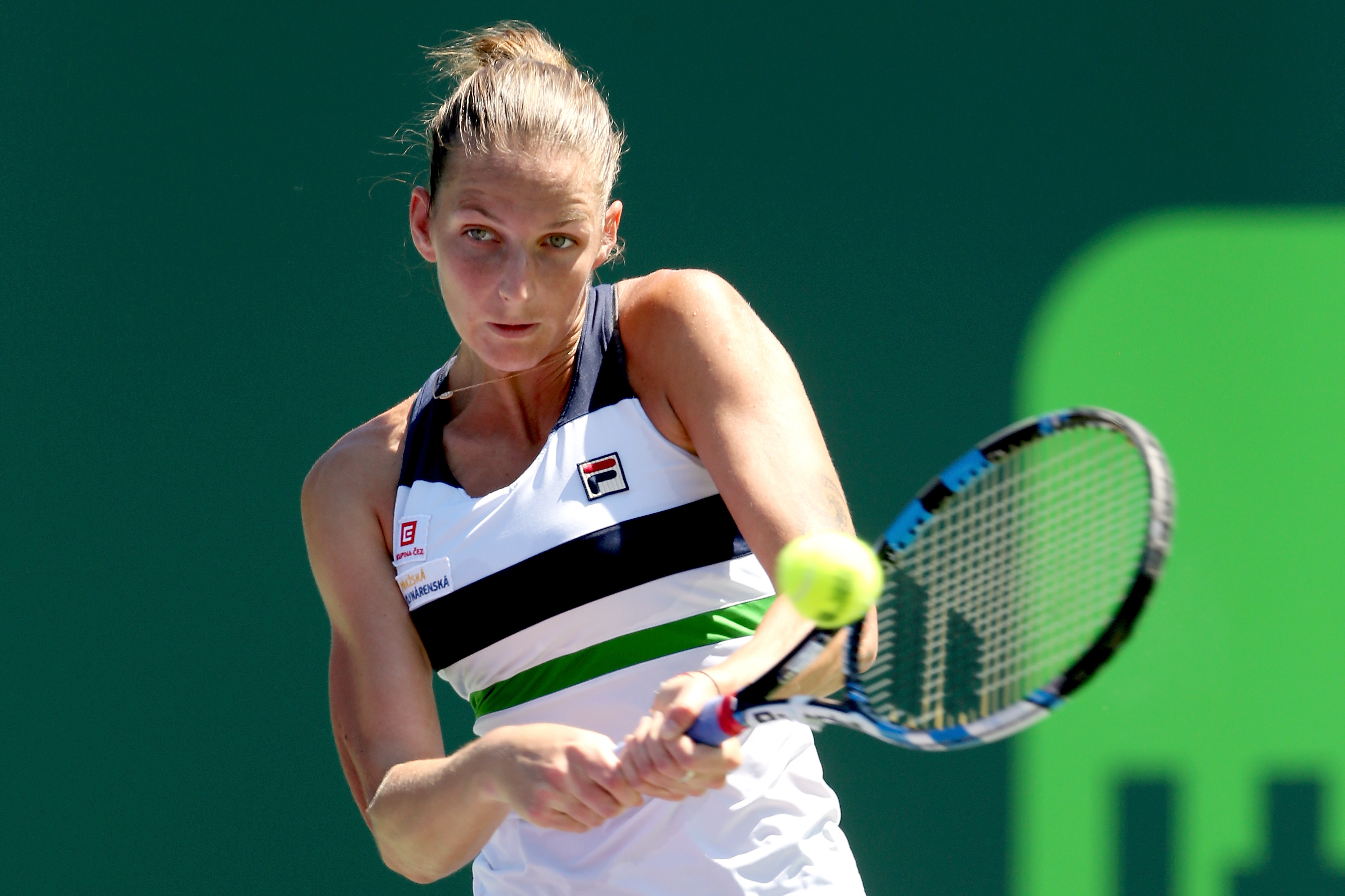 KEY BISCAYNE, FL - MARCH 28: Karolina Pliskova of Czech Republic returns a shot to Mirjana Lucic-Baroni of Croatia during the Miami Open at the Crandon Park Tennis Center on March 28, 2017 in Key Biscayne, Florida. (Photo by Matthew Stockman/Getty Images)