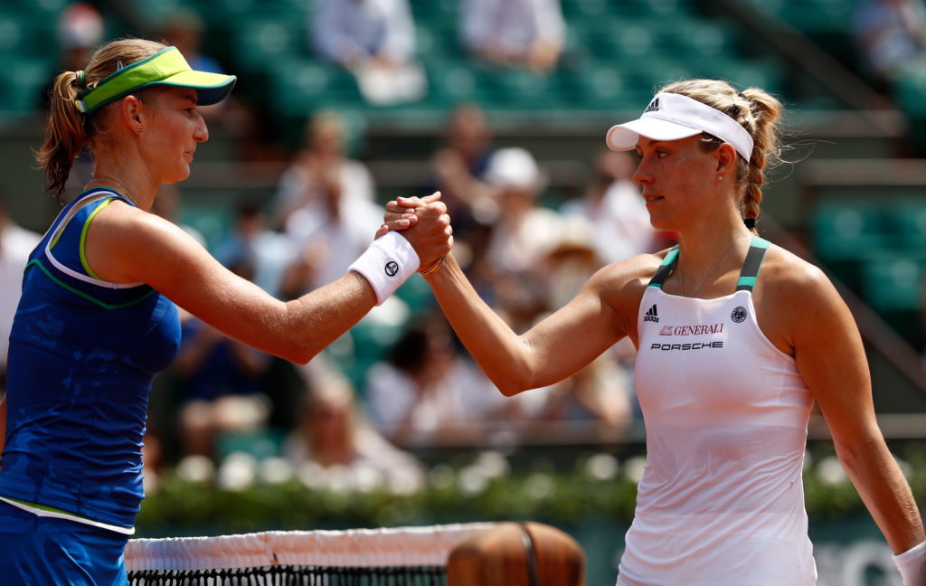 PARIS, FRANCE - MAY 28: A victorius Ekaterina Makarova of Russia (L) shakes hands with Angelique Kerber of Germany after the ladies singles first round match on day one of the 2017 French Open at Roland Garros on May 28, 2017 in Paris, France. (Photo by Adam Pretty/Getty Images)