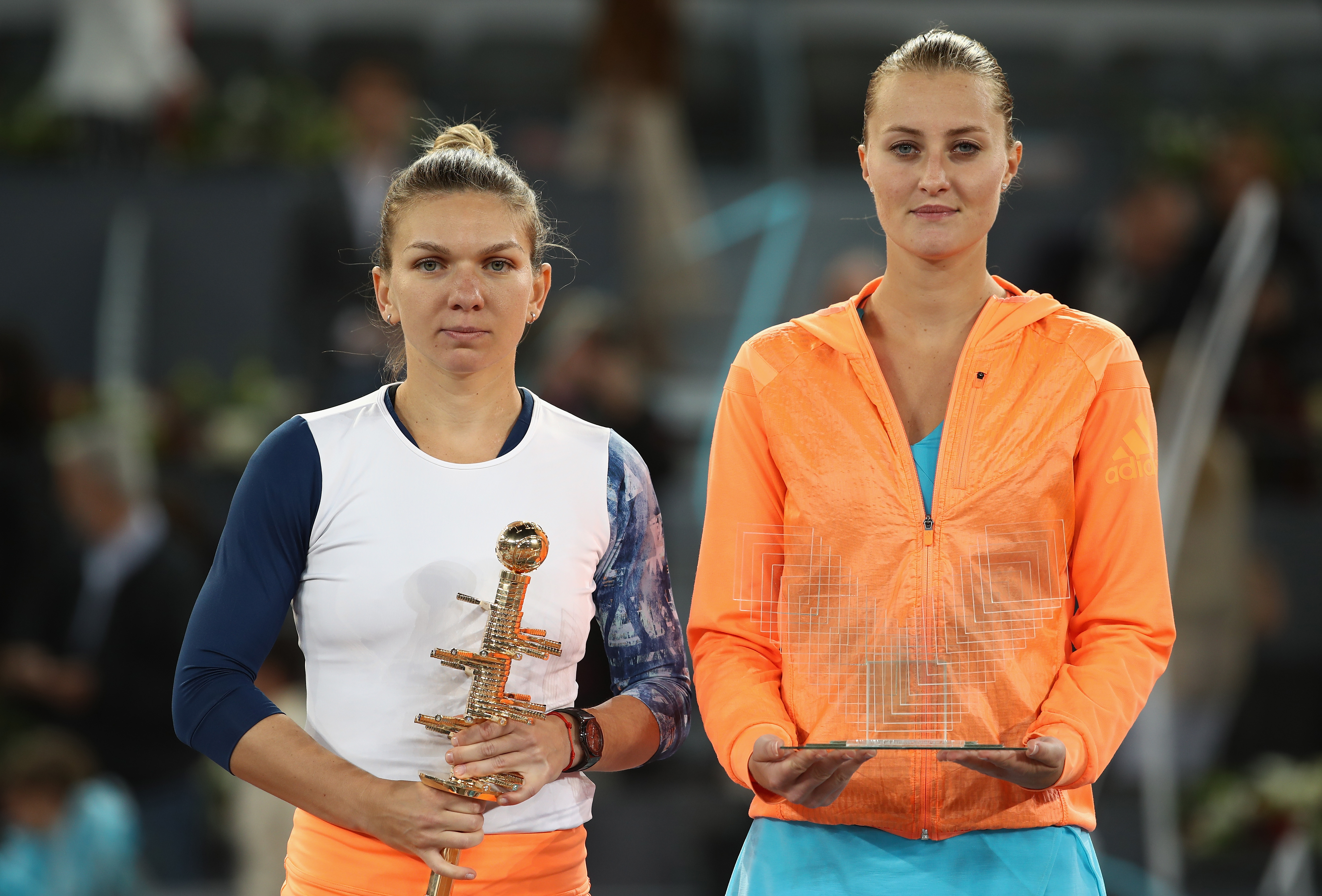 MADRID, SPAIN - MAY 13: Simona Halep of Romania with the winners trophy next to runner up Kristina Mladenovic of France after the final during day eight of the Mutua Madrid Open tennis at La Caja Magica on May 13, 2017 in Madrid, Spain. (Photo by Julian Finney/Getty Images)