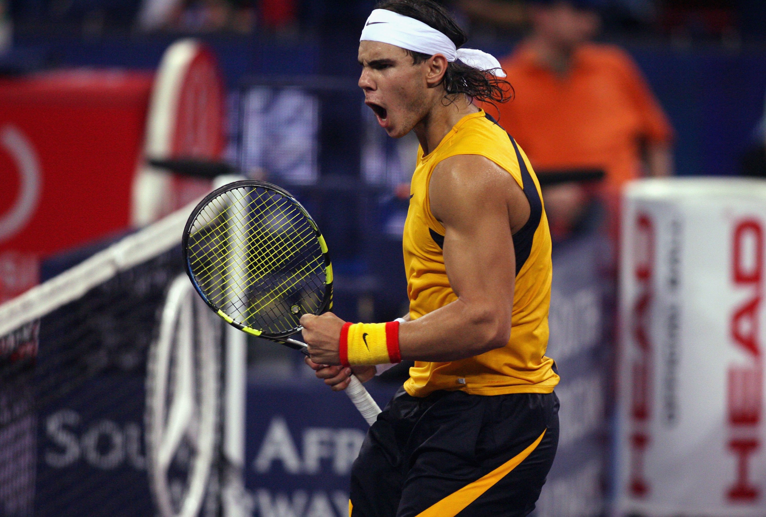 SHANGHAI, CHINA - NOVEMBER 17: (CHINA OUT) Rafael Nadal of Spain reacts during his last round robin match against Nikolay Davydenko of Russia at the Tennis Masters Cup Shanghai on November 17, 2006 at the Qi Zhong Tennis Stadium in Shanghai, China. (Photo by China Photos/Getty Images)