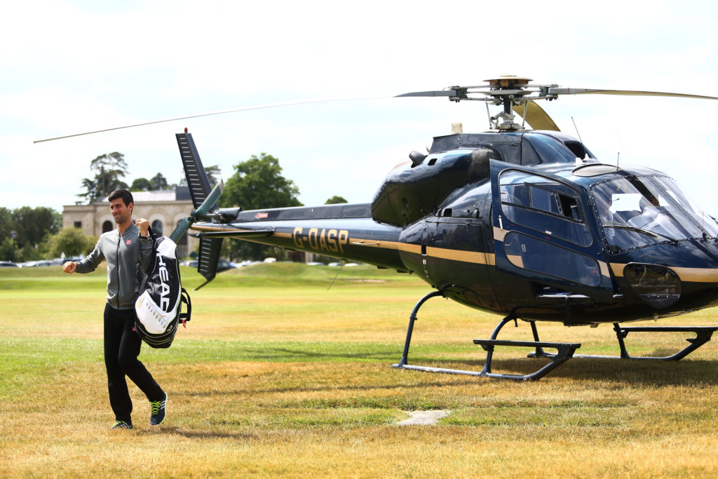 STOKE POGES, ENGLAND - JUNE 25:  Novak Djokovic of Serbia arrives by helicopter ahead of his match against Richard Gasquets of France during Day 3 of The Boodles Tennis Event at Stoke Park on June 25, 2015 in Stoke Poges, England.  (Photo by Jordan Mansfield/Getty Images)