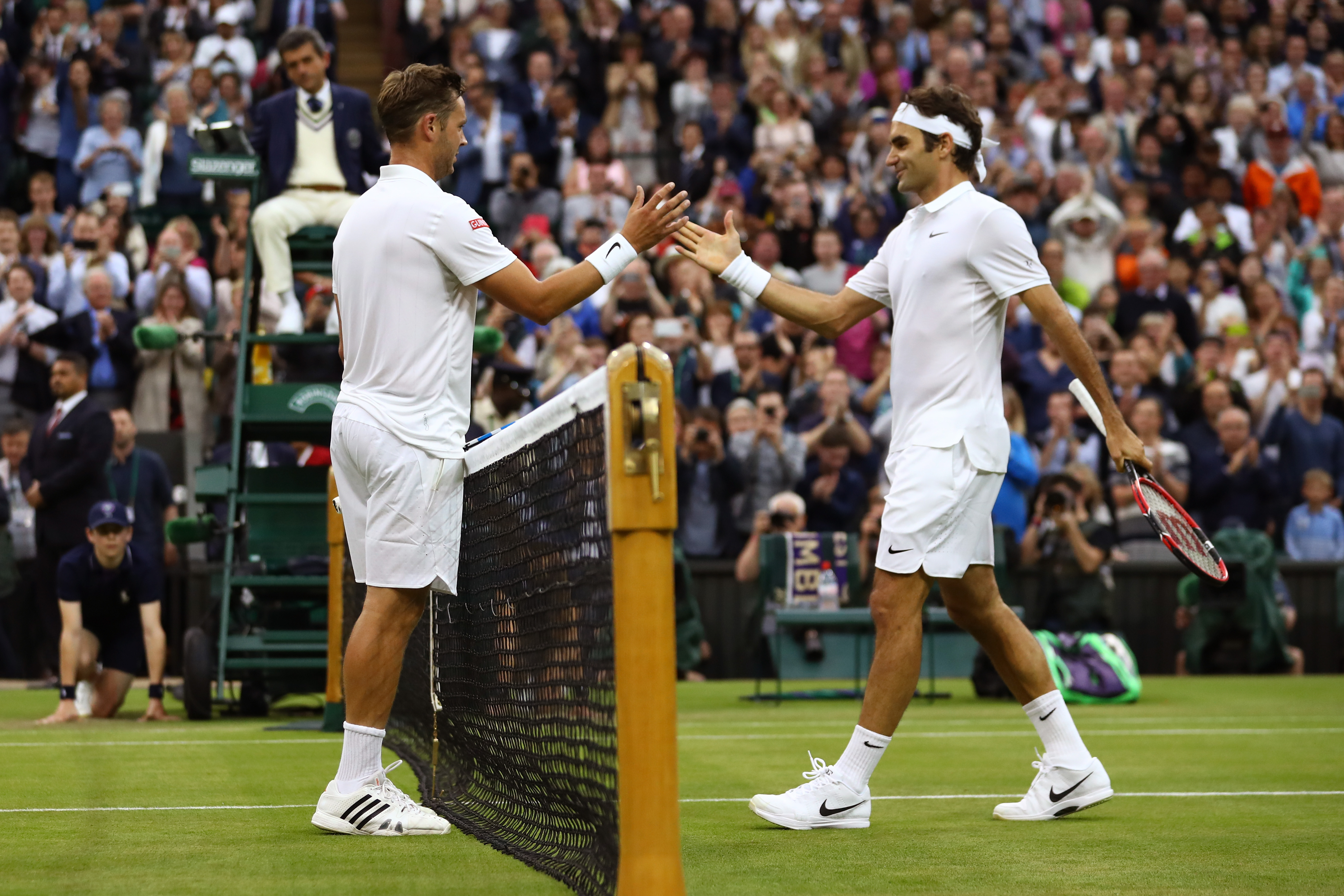 LONDON, ENGLAND - JUNE 29: Marcus Willis of Great Britain and Roger Federer of Switzerland shake hands following the Men's Singles second round match on day three of the Wimbledon Lawn Tennis Championships at the All England Lawn Tennis and Croquet Club on June 29, 2016 in London, England. (Photo by Julian Finney/Getty Images)