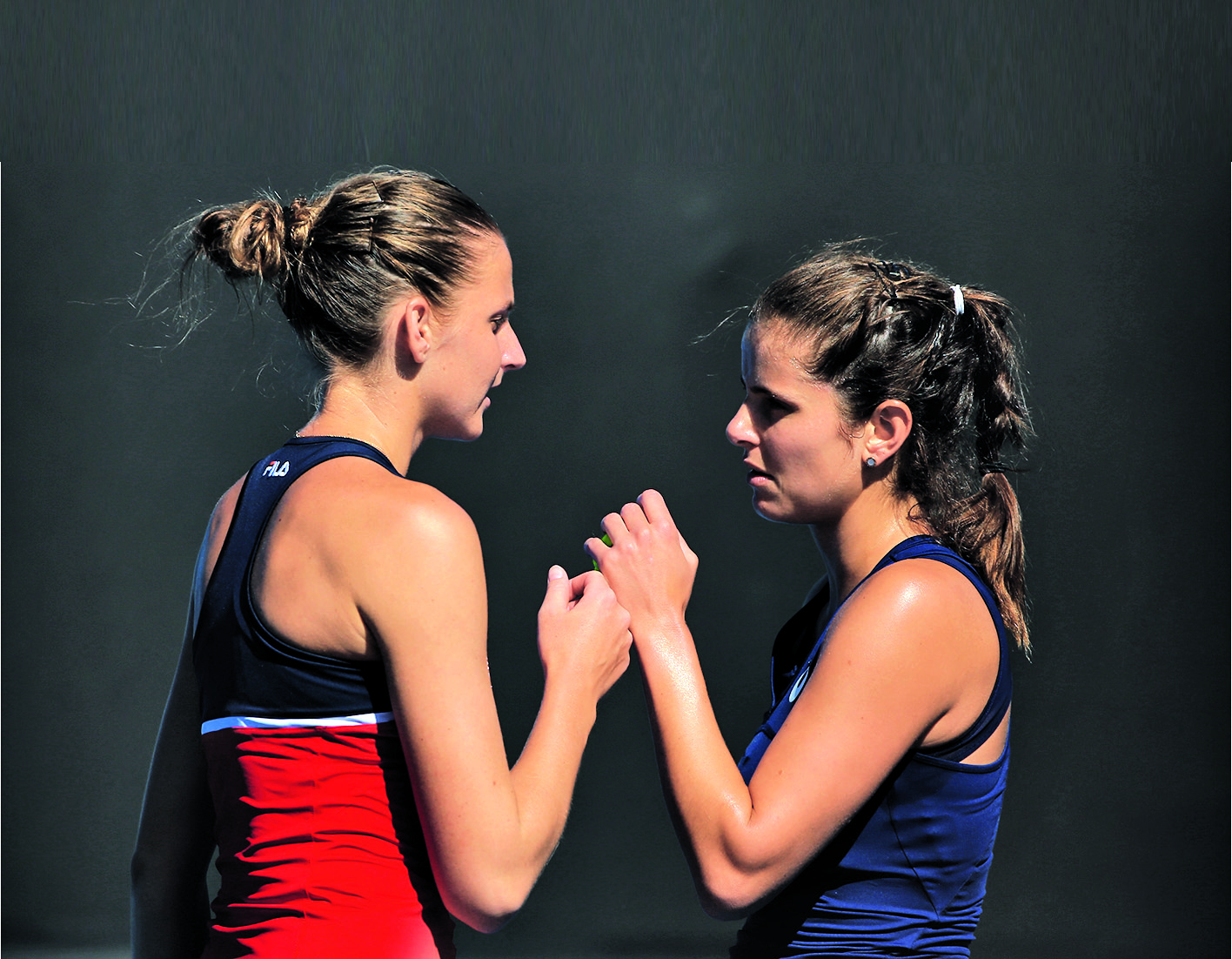 MELBOURNE, AUSTRALIA - JANUARY 19: Karolina Pliskova of the Czech Republic high fives Julia Goerges of Germany in their first match against Andreja Klepac of of Slovenia and Maria Jose Martinez Sanchez on day four of the 2017 Australian Open at Melbourne Park on January 19, 2017 in Melbourne, Australia. (Photo by Michael Dodge/Getty Images)