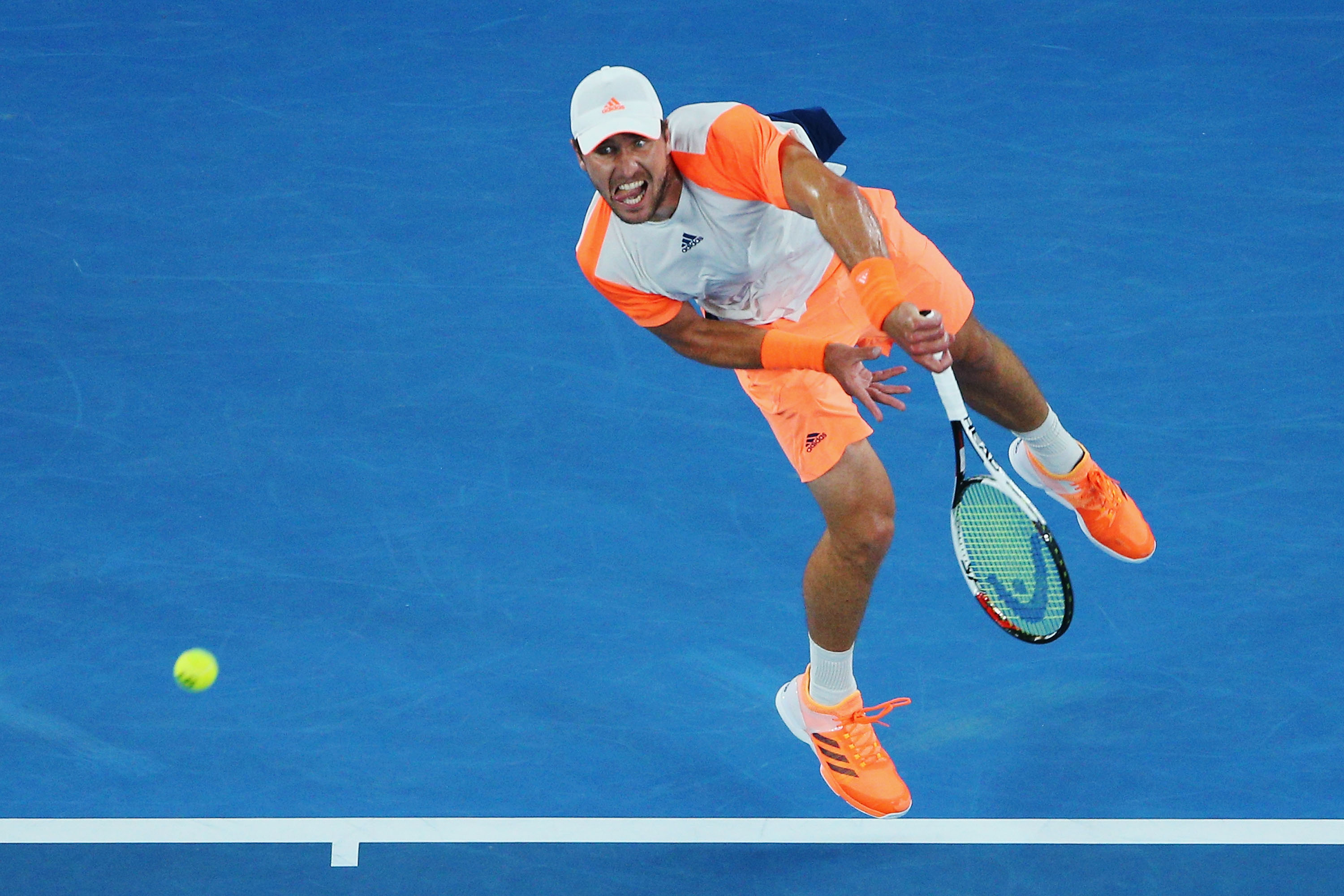 MELBOURNE, AUSTRALIA - JANUARY 24: Mischa Zverev of Germany serves in his quarterfinal match against Roger Federer of Switzerland day nine of the 2017 Australian Open at Melbourne Park on January 24, 2017 in Melbourne, Australia. (Photo by Michael Dodge/Getty Images)