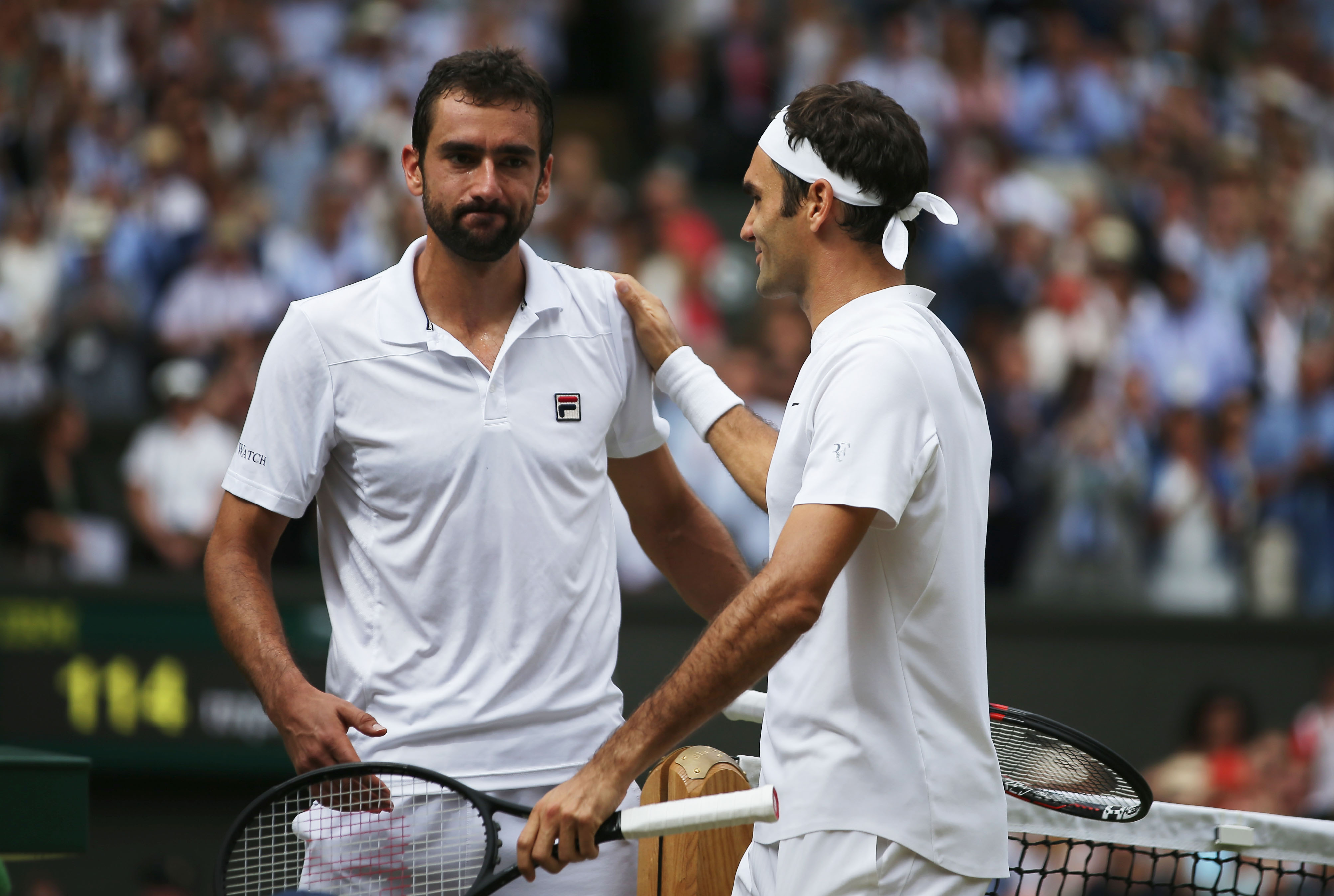 LONDON, ENGLAND - JULY 16: Roger Federer of Switzerland and Marin Cilic of Croatia shake hands after the Gentlemen's Singles final on day thirteen of the Wimbledon Lawn Tennis Championships at the All England Lawn Tennis and Croquet Club at Wimbledon on July 16, 2017 in London, England. (Photo by Daniel Leal-Olivas - Pool/Getty Images)