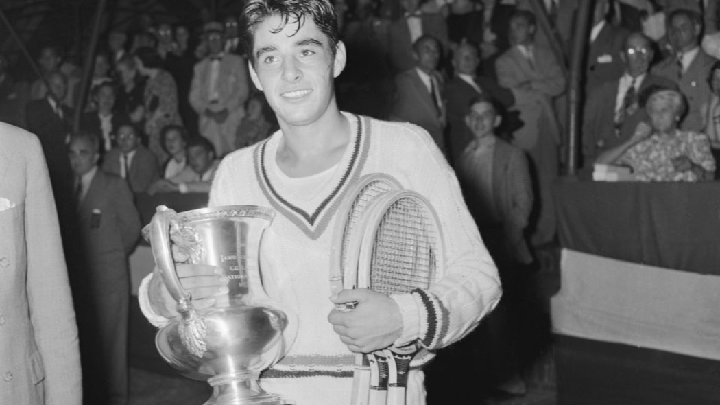 Richard Gonzales Holding Tennis Trophy