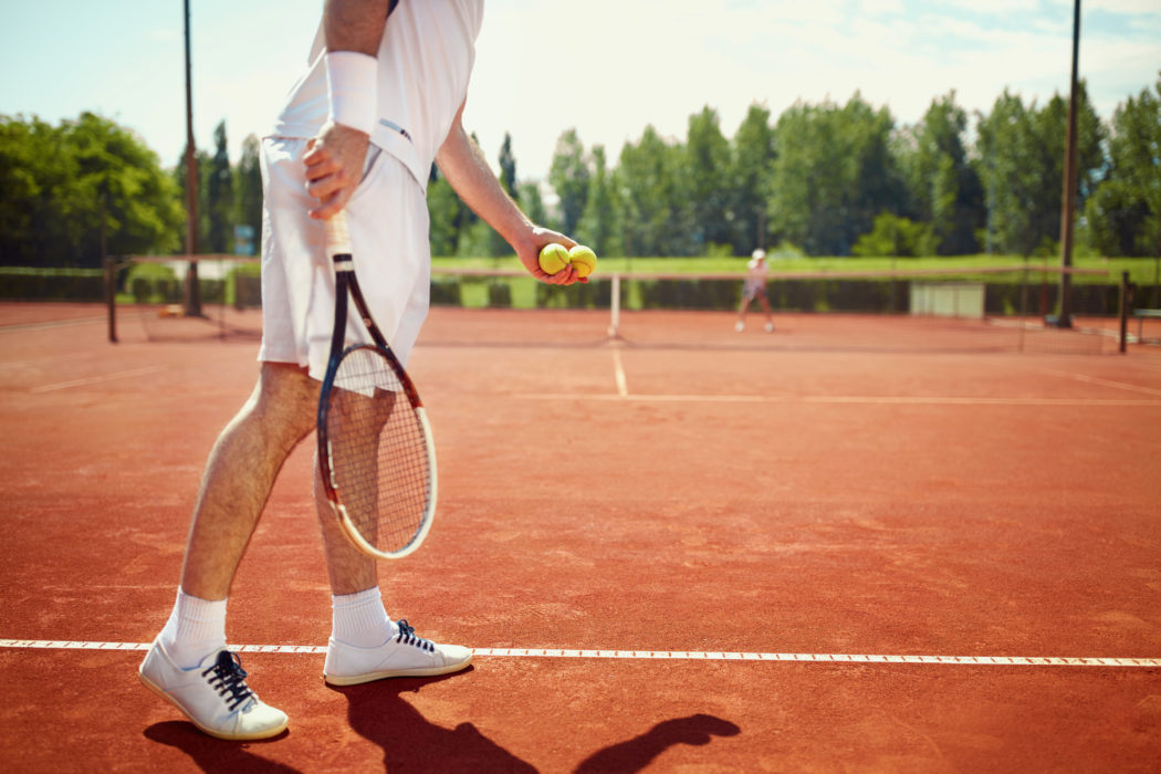Serving tennis ball
