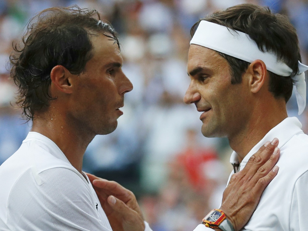 Rafael Nadal (l.) bedauert Roger Federers (r.) Rücktritt