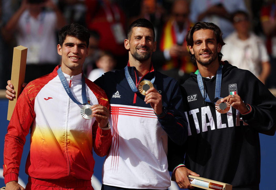 (240804) — PARIS, Aug. 4, 2024 — Gold medalist Novak Djokovic (C) of Serbia, silver medalist Carlos Alcaraz (L) of Spa