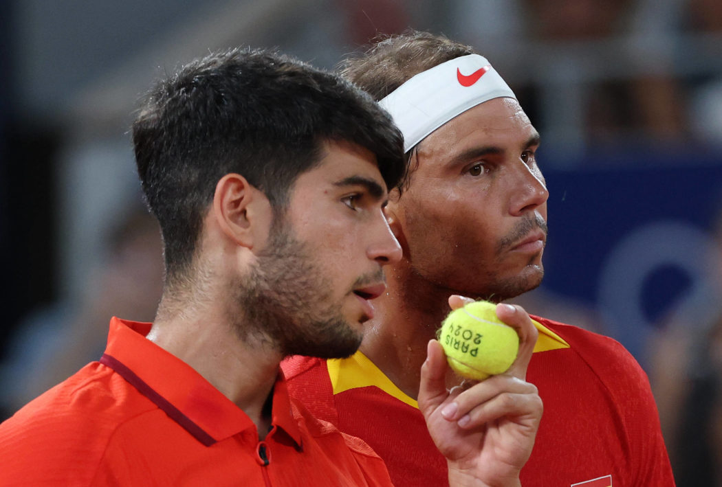 (240731) — PARIS, July 31, 2024 — Carlos Alcaraz (L)/Rafael Nadal of Spain react during the man s doubles quarter-fina