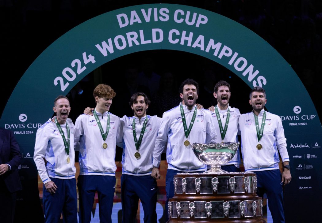 Team Italy celebrate winning the Davis Cup with the trophy Davis Cup Finals, Tennis, Palacio de Deportes Jose Maria Mart