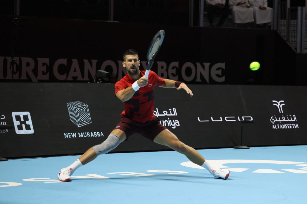 (241018) — RIYADH, Oct. 18, 2024 — Novak Djokovic of Serbia returns the ball to Jannik Sinner of Italy during their se